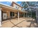 Spacious screened in lanai with tile flooring, ceiling fan, and view of the backyard at 17809 Sandpine Trace Way, Tampa, FL 33647