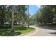 Scenic community entrance with lush landscaping and clear signage ensuring a welcoming atmosphere at 17809 Sandpine Trace Way, Tampa, FL 33647