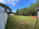 A view of the spacious backyard showcasing the fence line and serene surroundings at 17933 Eagle Ln, Lutz, FL 33558