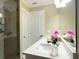 Bathroom featuring a modern sink, wood-look wall tile, and a glass-enclosed shower at 17933 Eagle Ln, Lutz, FL 33558