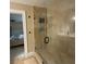 Modern bathroom showcasing a glass-enclosed shower with tiled walls and sleek fixtures at 17933 Eagle Ln, Lutz, FL 33558