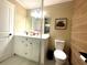Bright bathroom showcasing a stylish vanity with wood-look tile and modern fixtures at 17933 Eagle Ln, Lutz, FL 33558