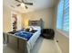 Comfortable bedroom with a ceiling fan and plenty of space, providing a peaceful retreat at 17933 Eagle Ln, Lutz, FL 33558