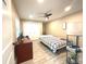 Bedroom with ceiling fan, closet and desk providing a comfortable place to relax and unwind at 17933 Eagle Ln, Lutz, FL 33558