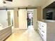 Bedroom featuring sliding barn doors, closet and ensuite bath at 17933 Eagle Ln, Lutz, FL 33558