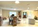 Bright dining room with wood table and chairs next to front door entrance at 17933 Eagle Ln, Lutz, FL 33558