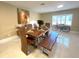 Dining room with rustic table, chairs, bench and bright natural light at 17933 Eagle Ln, Lutz, FL 33558