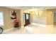 Bright and open foyer with marble floors, decorative lighting, and a stylish wooden front door at 17933 Eagle Ln, Lutz, FL 33558