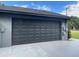 Garage showcases a well-maintained, functional space with neutral color scheme and exterior features at 17933 Eagle Ln, Lutz, FL 33558