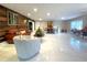 Stylish living room with marble floors, cozy furniture, and a view of the dining area at 17933 Eagle Ln, Lutz, FL 33558
