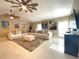 Comfortable living room showcasing neutral decor, ceiling fans, and bright natural light at 17933 Eagle Ln, Lutz, FL 33558