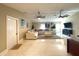 Bright living room featuring tile floors, modern furniture, and unique ceiling fans at 17933 Eagle Ln, Lutz, FL 33558