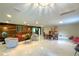 Bright living room with marble floors, comfortable seating, and a dining area at 17933 Eagle Ln, Lutz, FL 33558