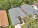 Aerial view of a home with a well-maintained roof and landscaped yard at 19156 Dove Creek Dr, Tampa, FL 33647