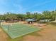 This image shows a basketball court, playground, and picnic shelter in a well-maintained recreational area at 19156 Dove Creek Dr, Tampa, FL 33647
