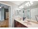 Bathroom boasting dual sinks with granite countertops and modern fixtures at 19156 Dove Creek Dr, Tampa, FL 33647