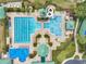 Aerial view of a large community pool with slides and recreation areas at 19156 Dove Creek Dr, Tampa, FL 33647