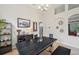 Dining room featuring a long table, modern decor, and views of the home's interior at 19156 Dove Creek Dr, Tampa, FL 33647