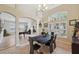 Spacious dining room area with elegant furnishings, and views into the game room at 19156 Dove Creek Dr, Tampa, FL 33647