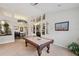 Open game room featuring a pool table, views into other rooms, and neutral walls at 19156 Dove Creek Dr, Tampa, FL 33647