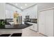 Bright kitchen features white cabinets, granite countertops, stainless steel appliances, and tiled backsplash at 19156 Dove Creek Dr, Tampa, FL 33647