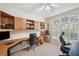 Bright office space with built-in shelves, desk, large window, and ample natural light at 19156 Dove Creek Dr, Tampa, FL 33647