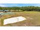 Spacious recreation field features a sand volleyball court, basketball court, and open green space for activities at 19156 Dove Creek Dr, Tampa, FL 33647