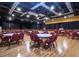 A large ballroom with plenty of seating and a performance stage creates an ideal space for events at 2014 Hampstead Cir, Sun City Center, FL 33573