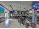 The bar features a variety of seating options and multiple TVs for entertainment in a well lit room at 2014 Hampstead Cir, Sun City Center, FL 33573
