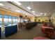 A wide bar area overlooks a lovely view with ample seating and a place to relax and have fun at 2014 Hampstead Cir, Sun City Center, FL 33573