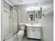 Bathroom featuring a glass door shower, vanity and medicine cabinet for convenient storage at 2014 Hampstead Cir, Sun City Center, FL 33573