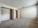Bedroom featuring neutral walls, plush carpeting and standard closet with shelving at 2014 Hampstead Cir, Sun City Center, FL 33573