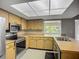 Spacious kitchen offering stainless appliances and wood cabinets at 2014 Hampstead Cir, Sun City Center, FL 33573