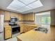 Bright kitchen featuring stainless steel appliances and a seamless open layout at 2014 Hampstead Cir, Sun City Center, FL 33573