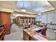 A well lit library with study and reading space features ample shelves for books and media at 2014 Hampstead Cir, Sun City Center, FL 33573