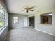 Open concept living area featuring a ceiling fan and natural light at 2014 Hampstead Cir, Sun City Center, FL 33573