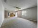 Bright open floor plan with large window into living room and view into the kitchen at 2014 Hampstead Cir, Sun City Center, FL 33573