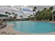 Outdoor community pool offering an abundance of seating and plenty of shade at 2014 Hampstead Cir, Sun City Center, FL 33573