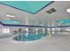 Indoor community pool featuring lots of light and comfortable seating at 2014 Hampstead Cir, Sun City Center, FL 33573