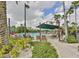 Outdoor community pool with plenty of shaded seating available for residents at 2014 Hampstead Cir, Sun City Center, FL 33573