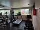 Community fitness center featuring treadmills and elliptical machines overlooking the pool at 213 Red Cedar Pl # 213, Brandon, FL 33510