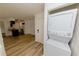 Stacked washer and dryer set conveniently located near the kitchen at 213 Red Cedar Pl # 213, Brandon, FL 33510