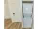 Convenient laundry area with stacked washer and dryer at 213 Red Cedar Pl # 213, Brandon, FL 33510