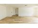 Open living room featuring wood-look floors and lots of natural light at 213 Red Cedar Pl # 213, Brandon, FL 33510