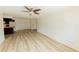 Open-concept living space with ceiling fan, modern floors, and ample natural light at 213 Red Cedar Pl # 213, Brandon, FL 33510
