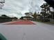 Community tennis court surrounded by a chain link fence offering a place for recreation at 213 Red Cedar Pl # 213, Brandon, FL 33510