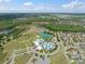 Overhead shot of community featuring pools, parks, and tennis courts, highlighting recreational opportunities at 21648 Snowy Orchid Ter, Land O Lakes, FL 34637