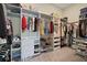 Walk-in closet with custom shelving, shoe racks, drawers, and plenty of storage space at 21648 Snowy Orchid Ter, Land O Lakes, FL 34637