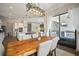 Dining room features a wooden table and offers a seamless transition to the outdoor patio at 21648 Snowy Orchid Ter, Land O Lakes, FL 34637