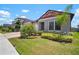 Attractive single-story home with well-manicured lawn and lush landscaping at 21648 Snowy Orchid Ter, Land O Lakes, FL 34637